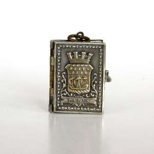 Miniature metal book with the coat of arms of the city of Paris