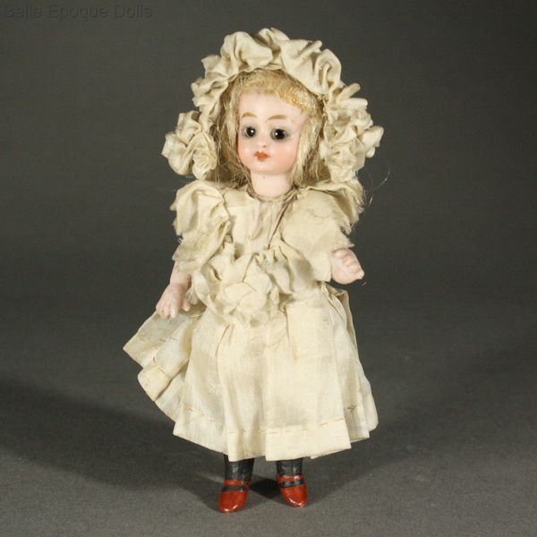 black-stockinged miniature doll , Antique all bisque doll mignonette Simon Halbig  , Antique german solid domed mignonette