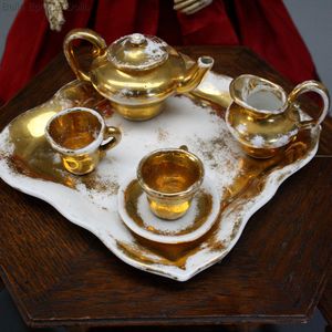 Antique Tea Service in white Porcelain with gilt painting