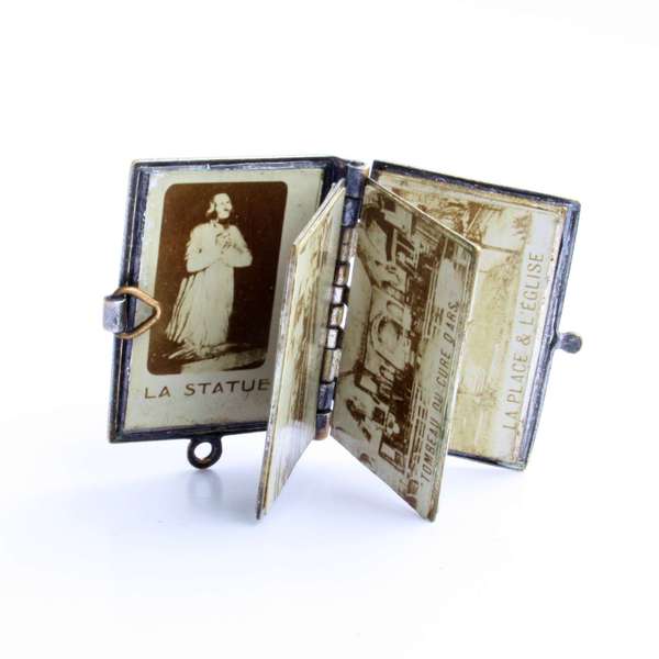 Holy Priest of Ars , antique metal book