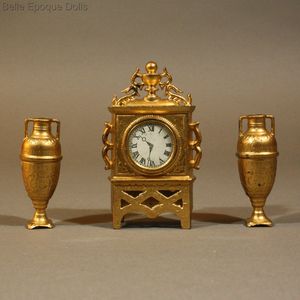 Antique Miniature Gilt Painted Mantel Clock with its two Matching Vases