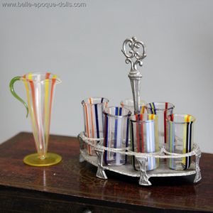 Antique Pitcher and Colorful Blown Glasses on Serving Tray