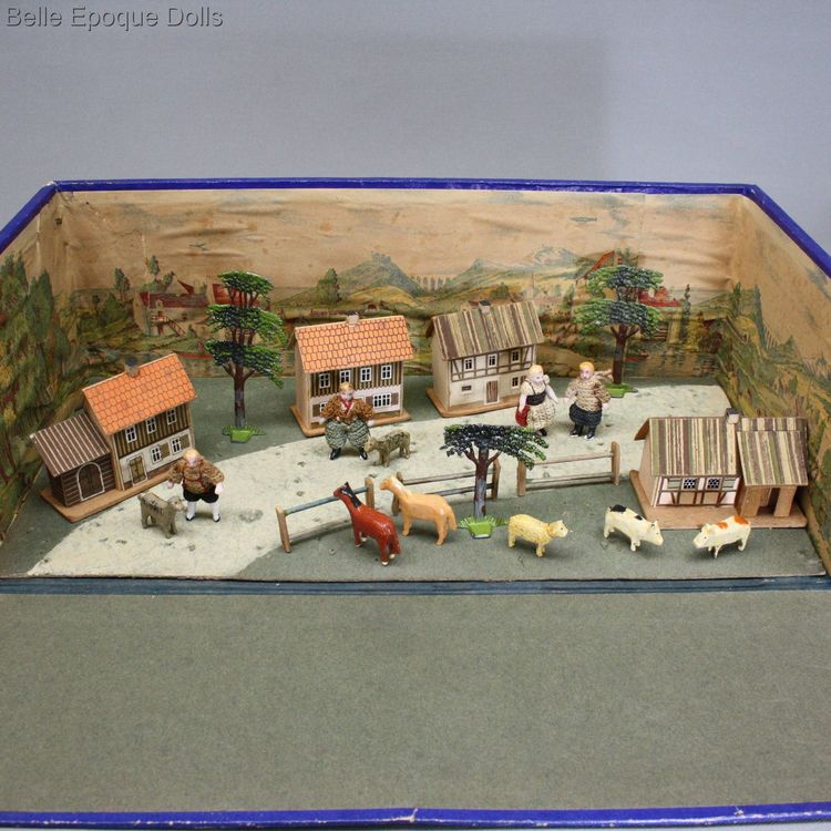 antique miniature wooden animals , farms and pastures antique cardboard box , antique miniature wooden animals