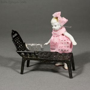 All-Bisque Doll and its metal Deckchair by Simon  Rivollet