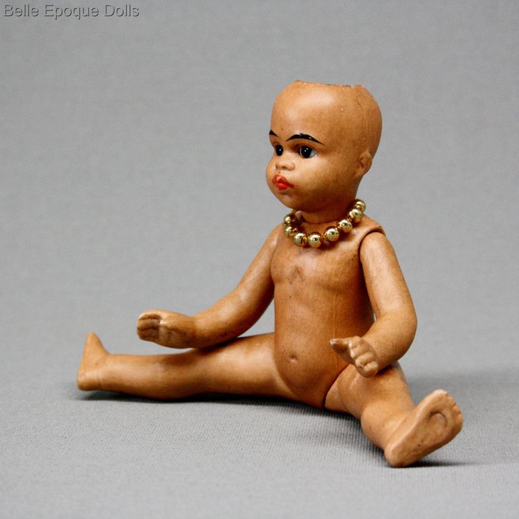 antique mulatto Gebruder Kuhnlenz doll , Antique Dollhouse miniature , light brown complexioned all bisque doll