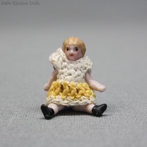 All-bisque Doll  by Carl Horn  - The tiny Girl with Yellow and White Dress