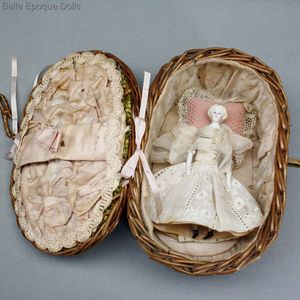 Antique Miniature Dollhouse Doll with Very Pale complexion in a Wicker Basket