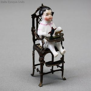 antique Seated frozen charlotte , antique porcelain doll , antique metal high chair seated all-bisque doll 