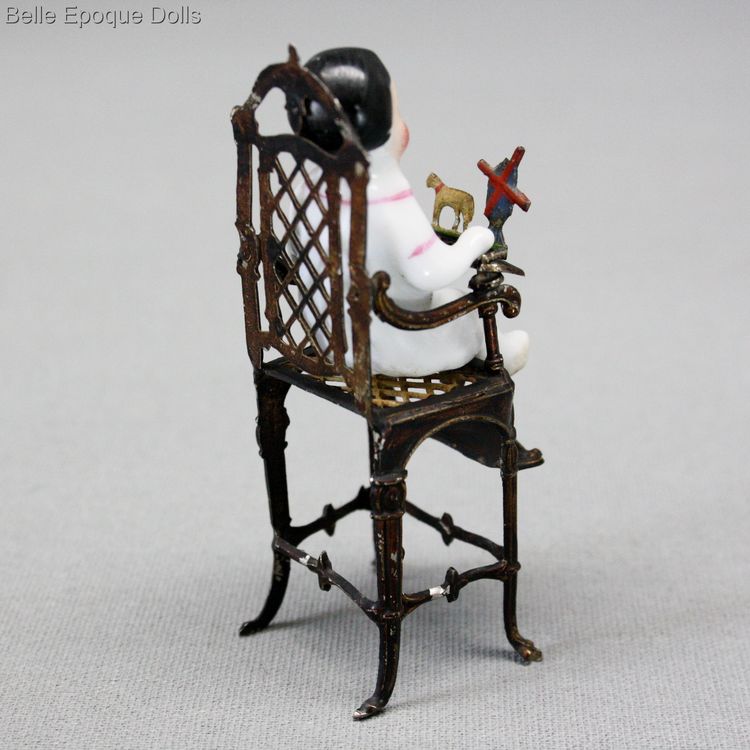 ganzbiskuit puppenstubenpuppen , antique Seated frozen charlotte , antique metal high chair seated all-bisque doll